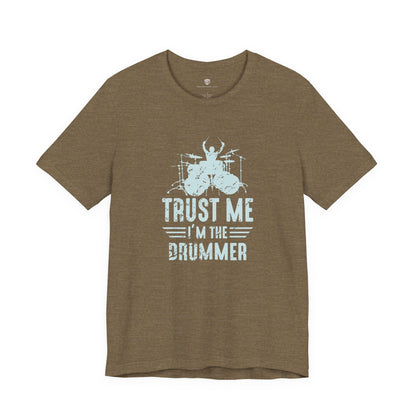 Green t-shirt with white graphic and text 'Trust Me I'm the Drummer' on a white background