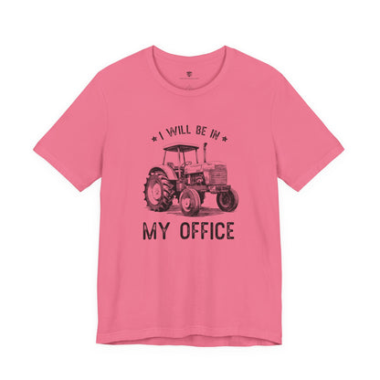 Pink t-shirt with a tractor graphic and text