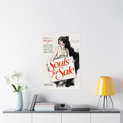 Vintage movie poster for 'Souls for Sale' on a wall above a shelf with decor items.