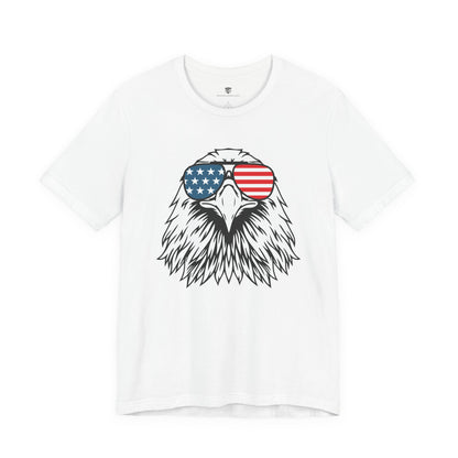 White t-shirt with an eagle design wearing American flag sunglasses on a white background