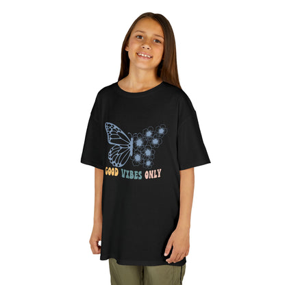 Young girl wearing a black t-shirt with a butterfly design and text on a white background