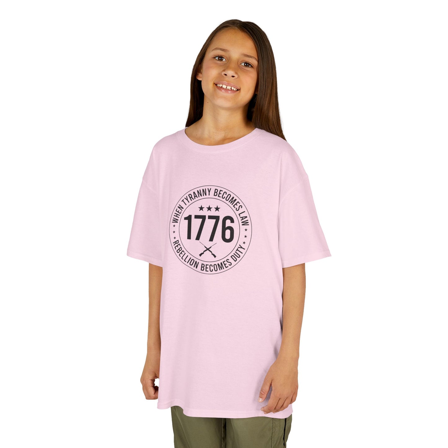 Young girl wearing a pink t-shirt with text and numbers on a white background