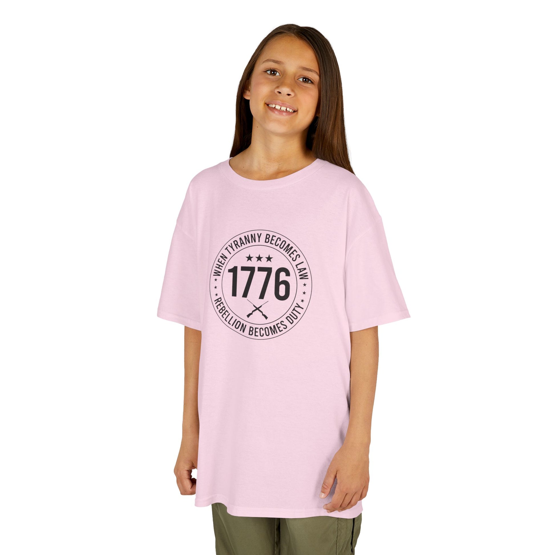 Young girl wearing a pink t-shirt with text and numbers on a white background
