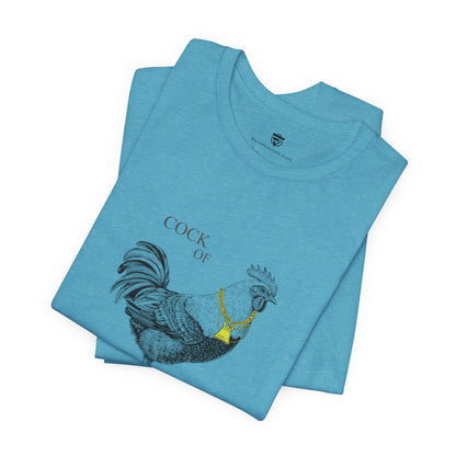 Folded blue t-shirt with a rooster graphic and text on a white background