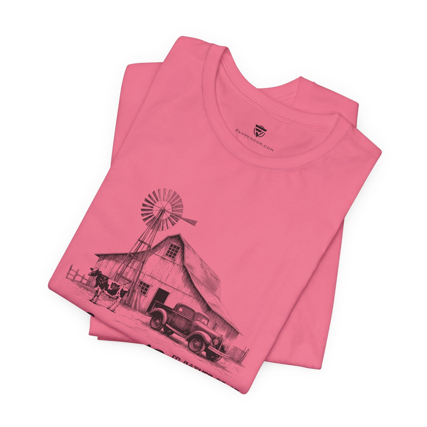 Pink t-shirt with a graphic design of a barn and windmill 