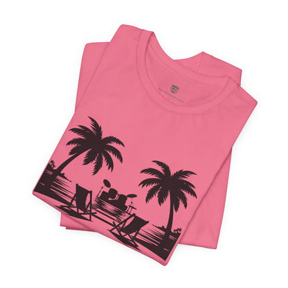 Pink t-shirt with black palm tree and beach scene design on a white background
