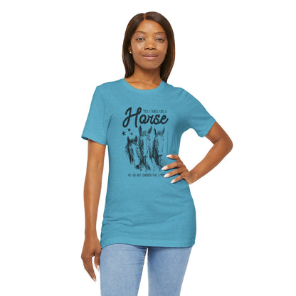 Woman wearing a blue t-shirt with a graphic design and text 
