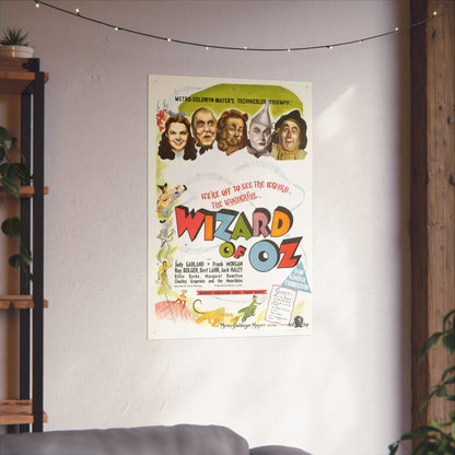 Vintage 'Wizard of Oz' movie poster on a wall with decorative lights.