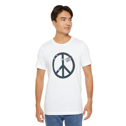 Man wearing a white t-shirt with a peace symbol design on a white background