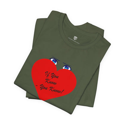 Folded green t-shirt with a red heart design and text on a white background