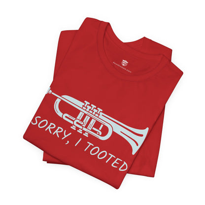 Red t-shirt with a white trumpet graphic and text on a white background