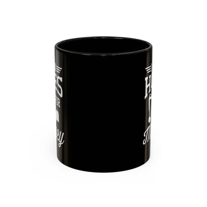 Black mug with white text on a white background