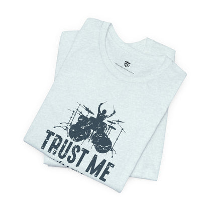 White top with black graphic and 'Trust Me' text on a white background