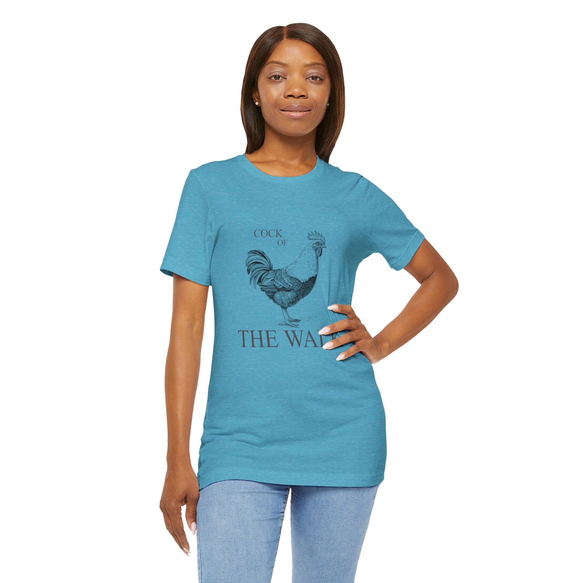 Woman wearing a blue t-shirt with a rooster graphic and text 
