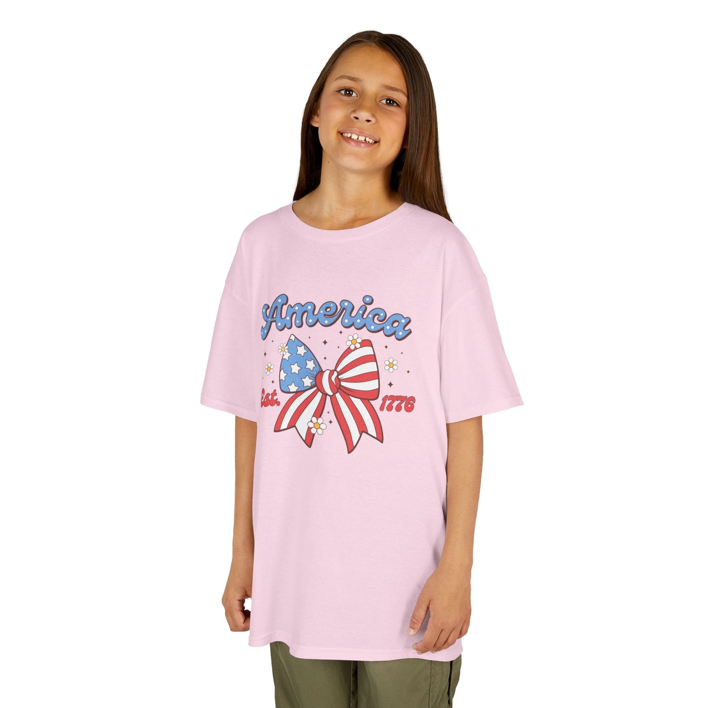Girl wearing a pink t-shirt with a bow and 'America' text on a white background