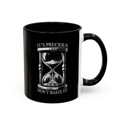 Black mug with an hourglass design and text on a white background