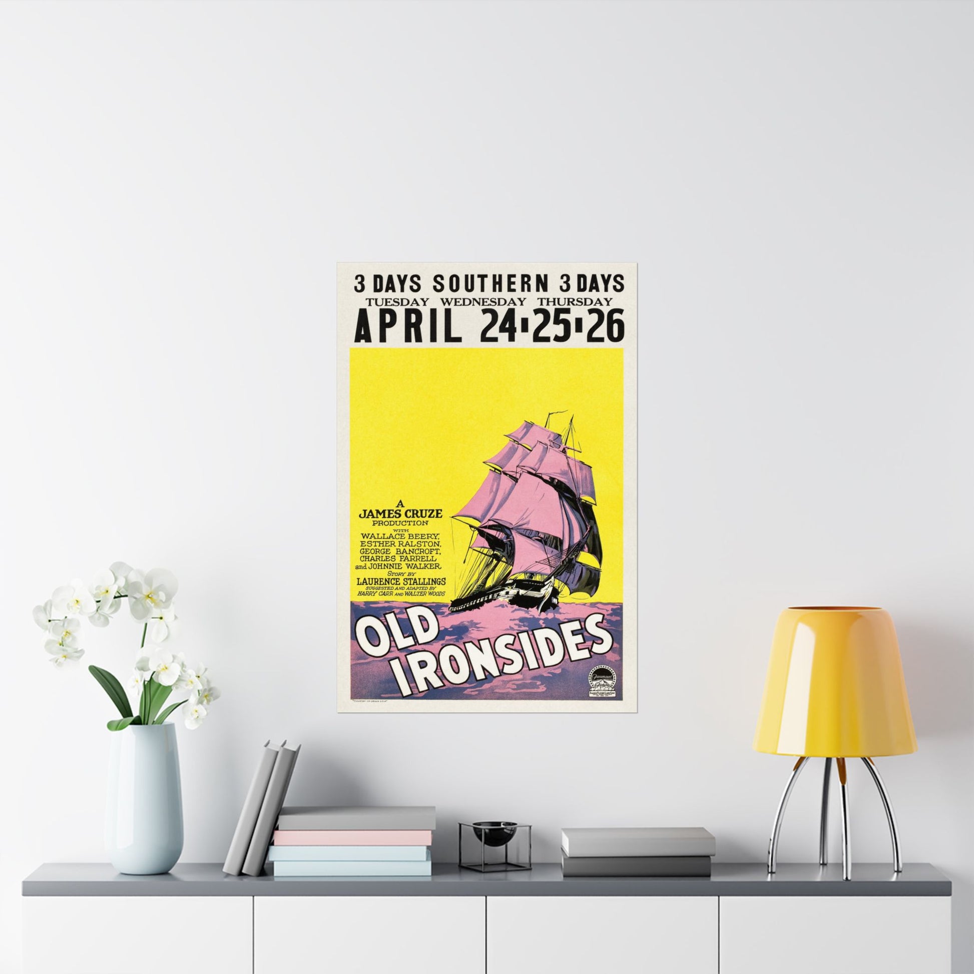 Vintage-style poster for 'Old Ironsides' on a wall above a shelf with decor items.