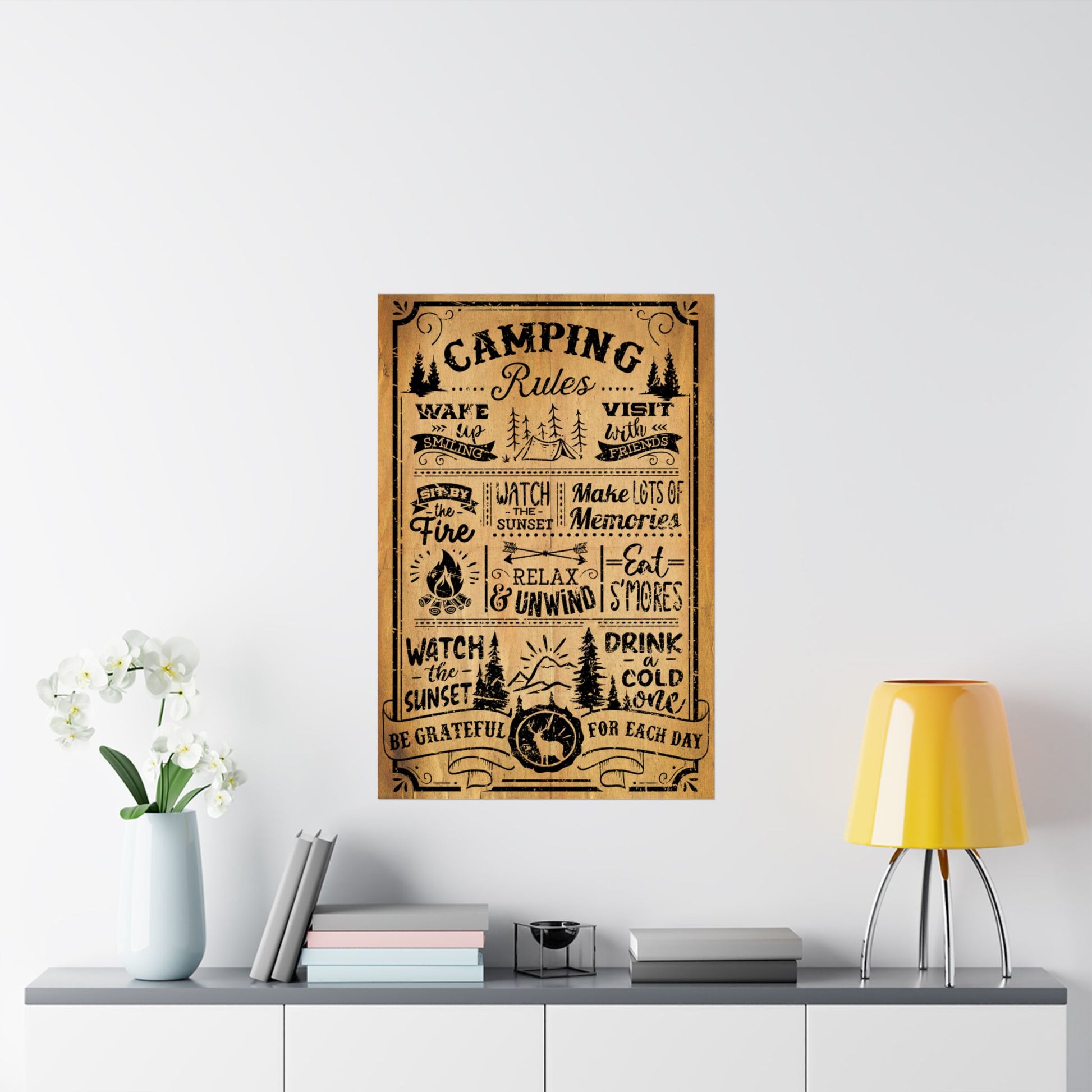 Camping rules poster on a wall above a shelf with decor items.