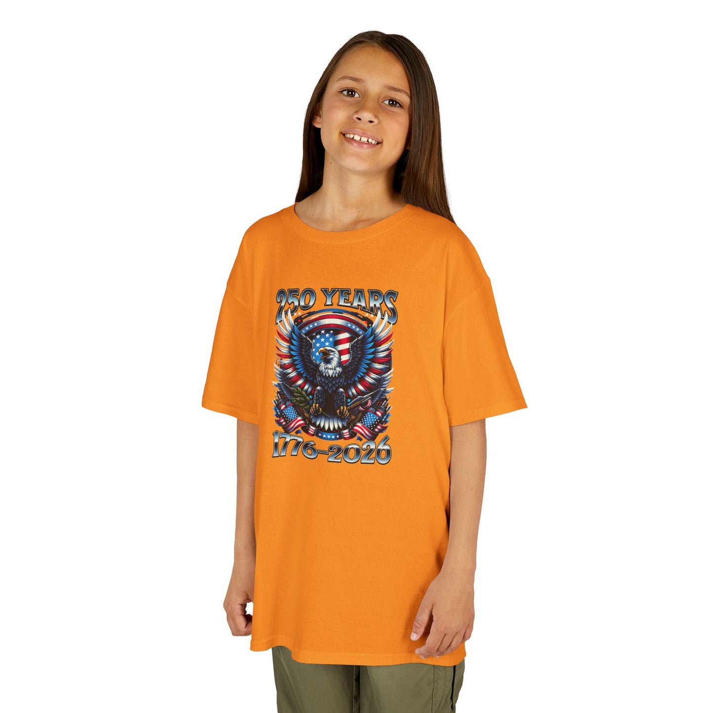 Child wearing an orange t-shirt with a graphic design on a white background