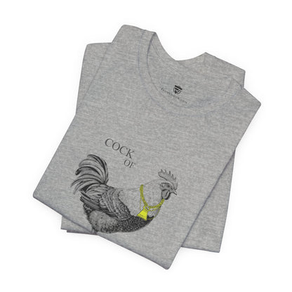 Folded gray t-shirt with a rooster design and text on a white background
