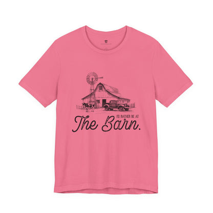 Pink t-shirt with a graphic of a barn and truck, and text 'I'd Rather be at The Barn'