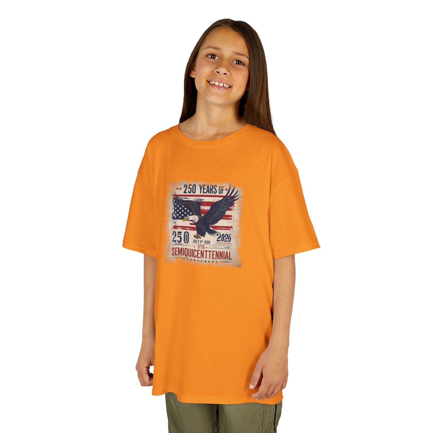 Child wearing an orange t-shirt with a graphic design on a white background