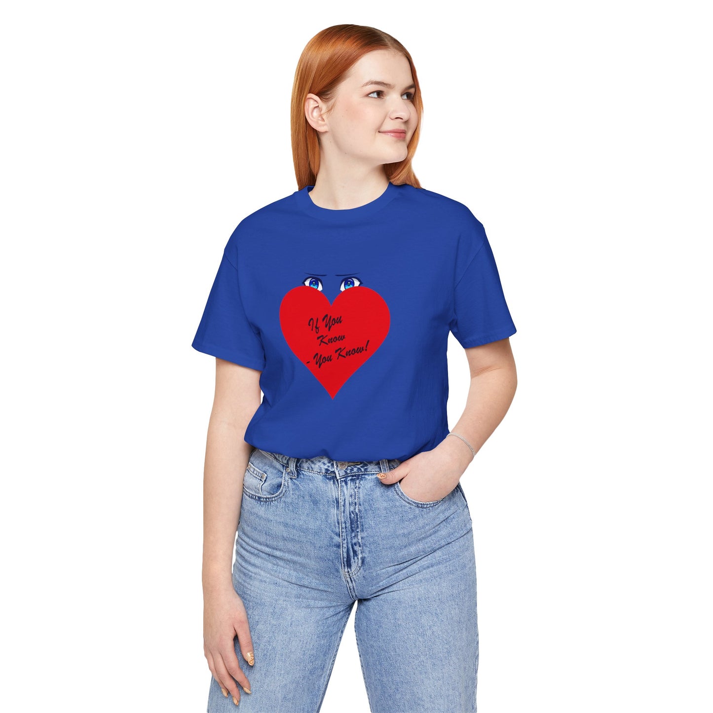 Person wearing a blue t-shirt with a red heart design on a white background