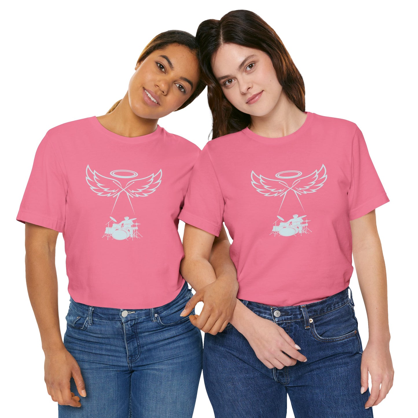 Two people wearing pink t-shirts with text standing close together on a white background