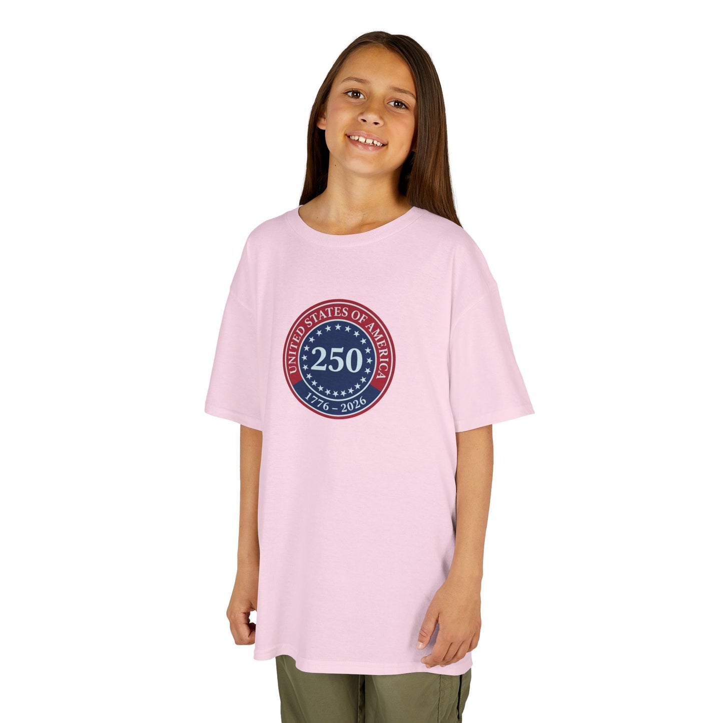 Young girl wearing a pink t-shirt with a circular design on a white background