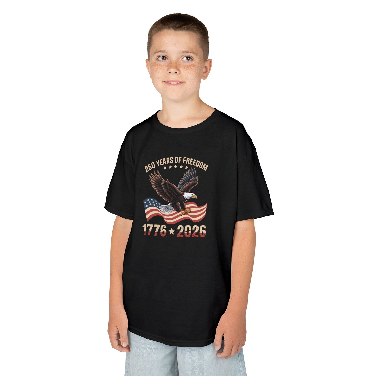 Child wearing a black t-shirt with a colorful design on a white background