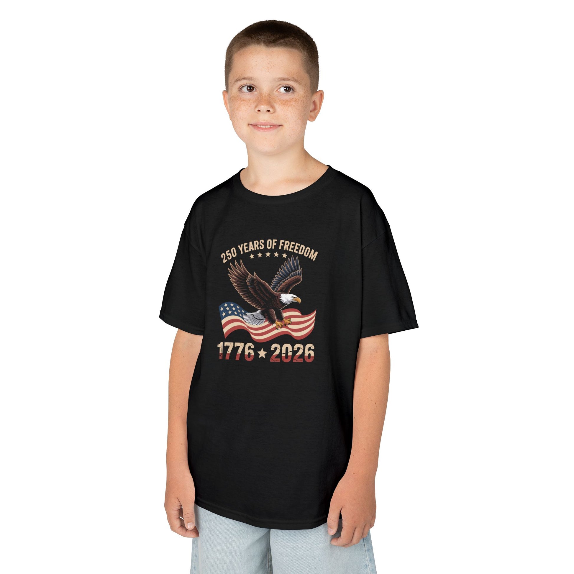 Child wearing a black t-shirt with a colorful design on a white background