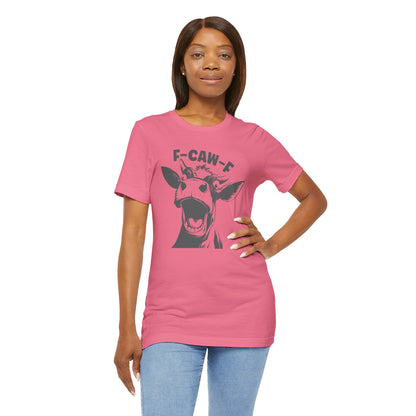 Woman wearing a pink t-shirt with a graphic design 