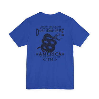 Blue t-shirt with black graphic and text on a white background