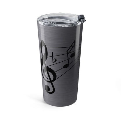 Gray tumbler with music note design on a white background