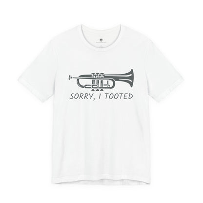 White t-shirt with a black trumpet graphic and text 'Sorry, I Tooted' on a white background