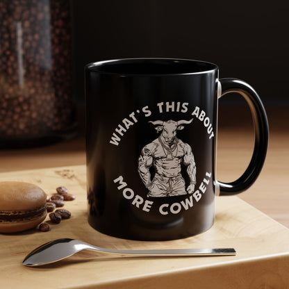 Black mug with graphic and text on a wooden surface with coffee beans and a spoon.