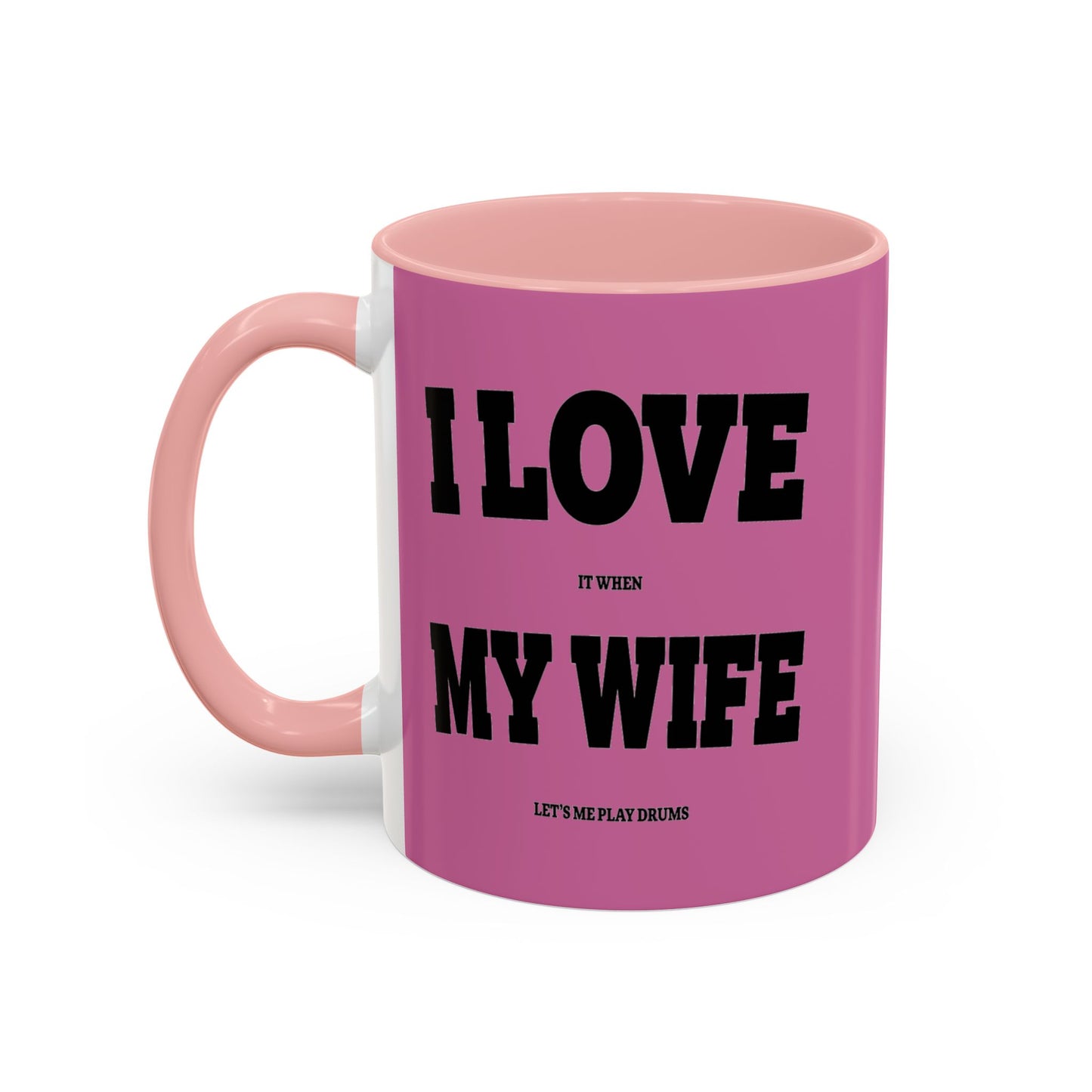 Pink mug with black text on a white background
