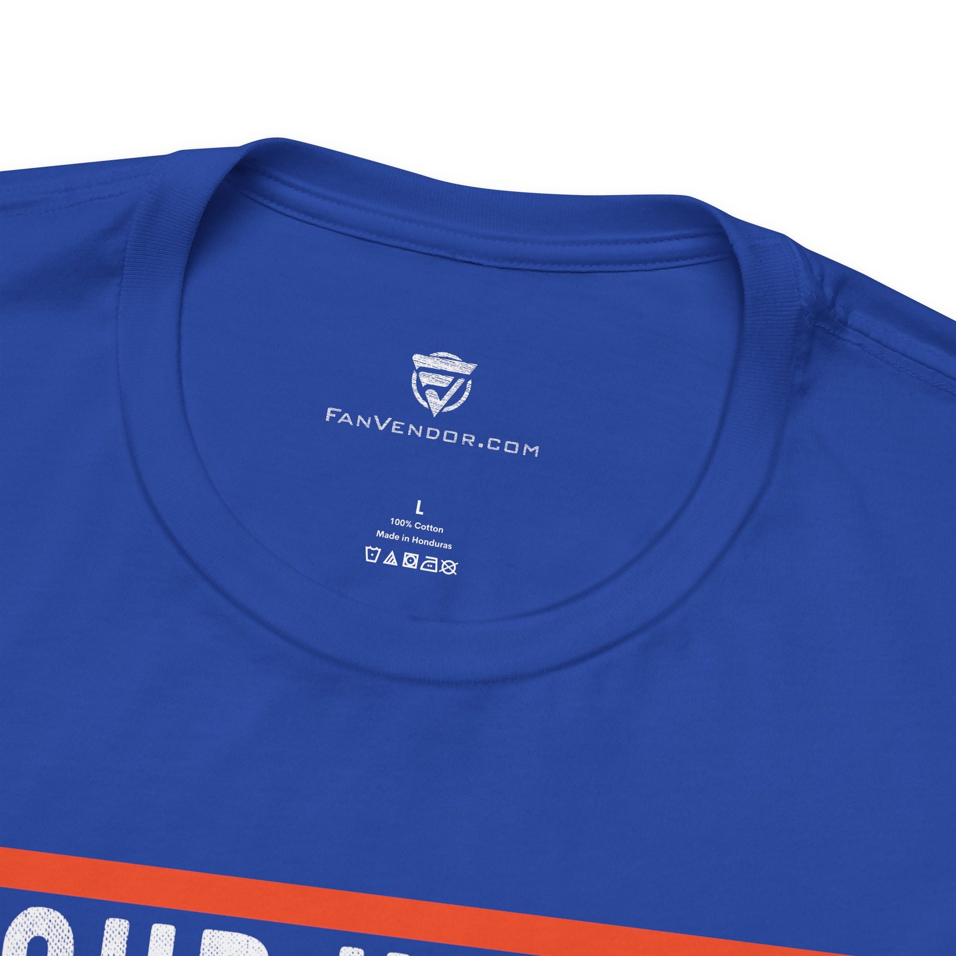 Close-up of a blue t-shirt with 'FanVendor.com' logo and text on a white background