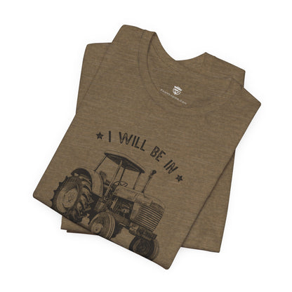 Brown t-shirt with tractor graphic and text 