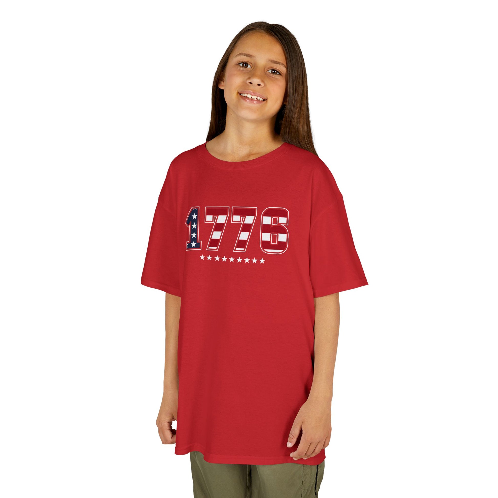 Child wearing a red t-shirt on a white background
