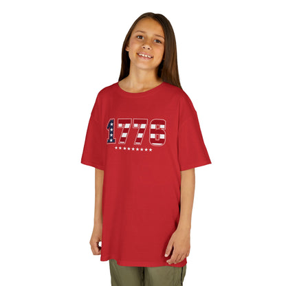 Child wearing a red t-shirt on a white background