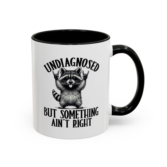 White mug with black handle featuring text and graphic on a white background