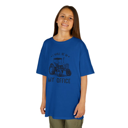 Child wearing a blue t-shirt with text on a white background