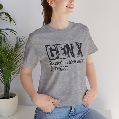 Person wearing a gray t-shirt with 'GENX Raised on hose water & neglect' text, standing indoors.