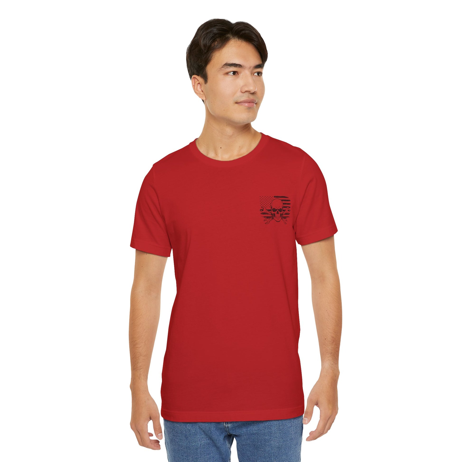 Man wearing a red t-shirt with a small graphic on a white background