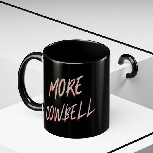 Black mug with 'More Cowbell' text on a white background