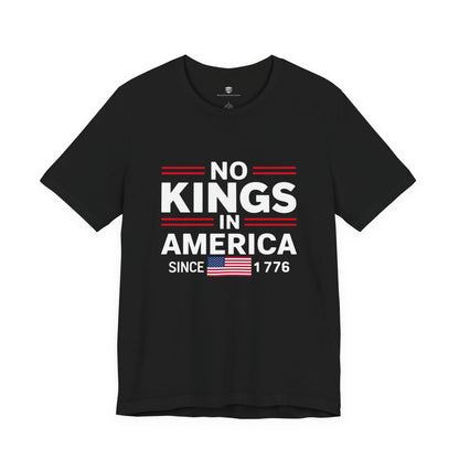 Black t-shirt with 'No Kings in America Since 1776' text and American flag on a white background