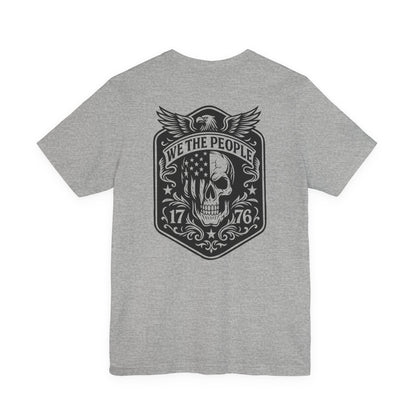 Gray t-shirt with a black graphic design on the back featuring a skull and text.
