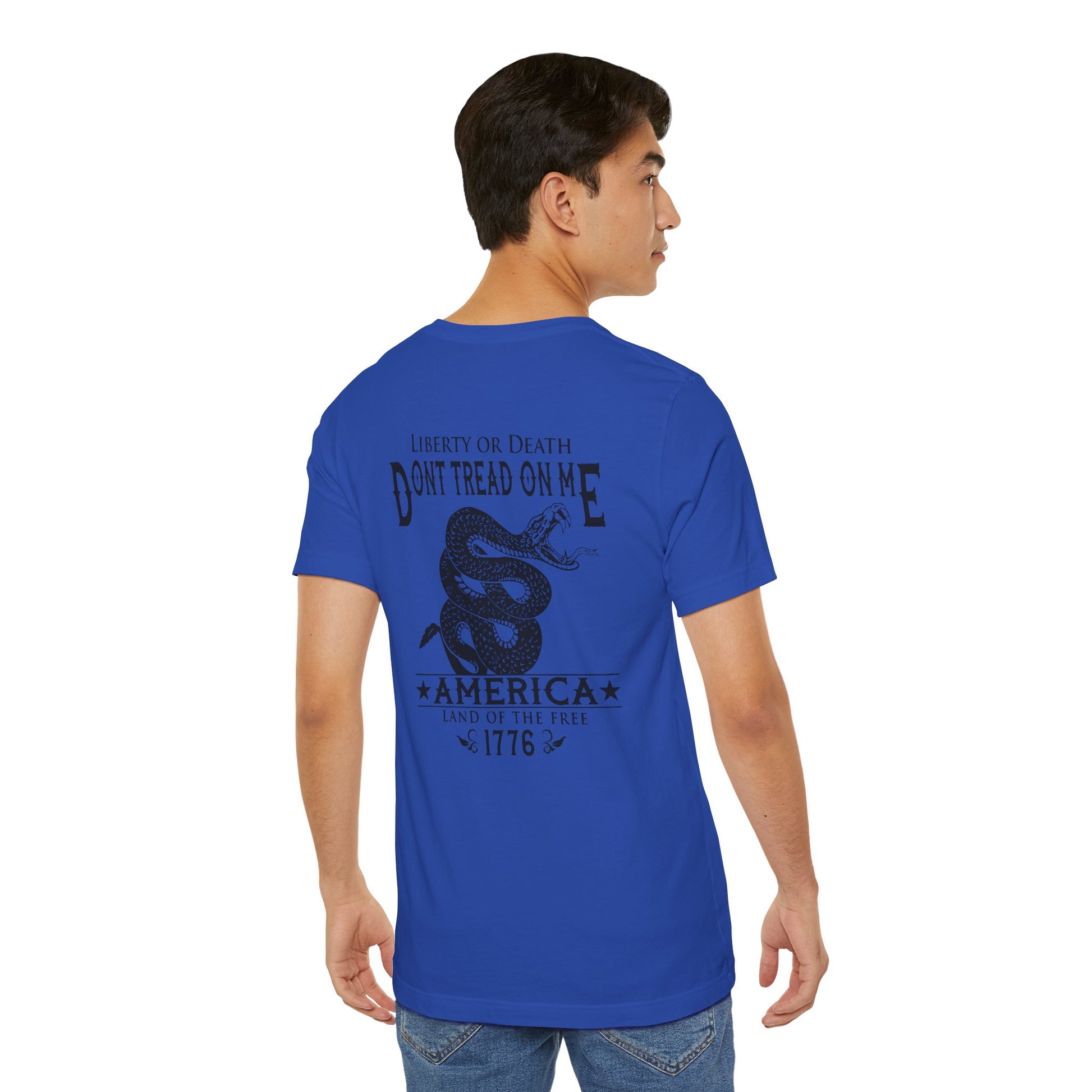 Man wearing a blue t-shirt with 'Don't Tread on Me' graphic and text.