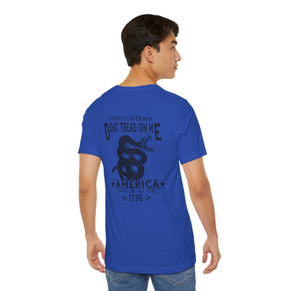 Man wearing a blue t-shirt with 'Don't Tread on Me' graphic and text.
